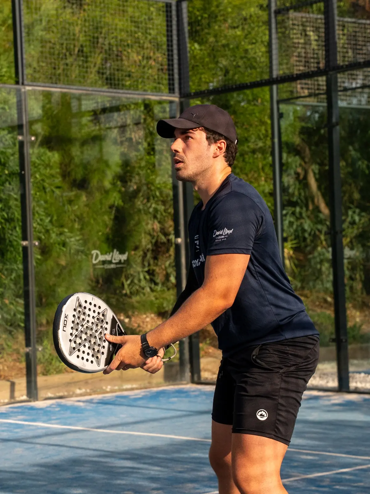 Player waiting for the serve on an outdoor court